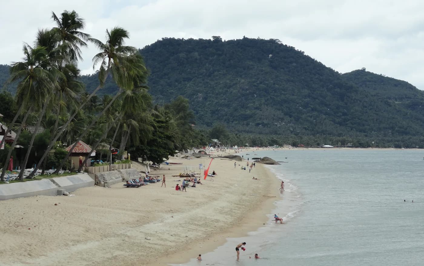 Sand and palms along Lamai Beach, Samui, on a cloudy day in 2011