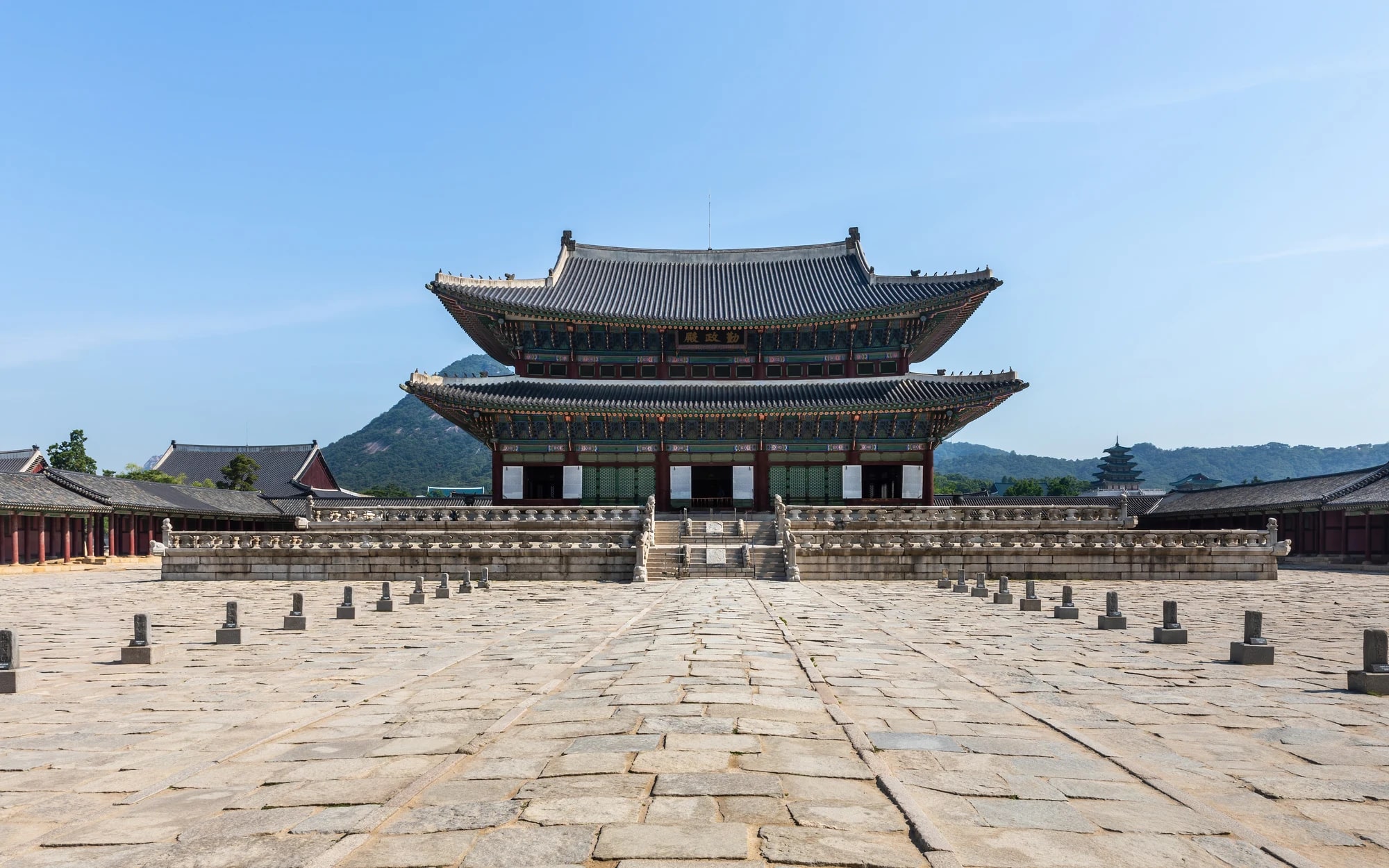 Geunjeongjeon throne hall at Gyeongbokgung Palace in Seoul beneath a blue sky